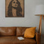 Carved wood portrait of Fairuz with “Bhebbak Ya Lebnan” lyrics in a living room.
