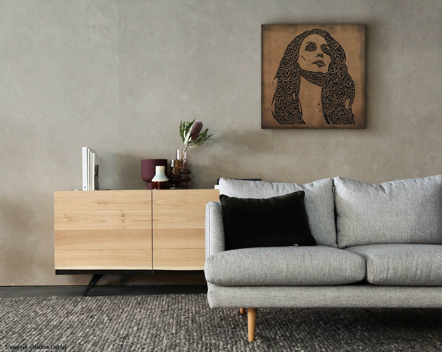 Carved wood portrait of Fairuz with “Bhebbak Ya Lebnan” lyrics in a living room.
