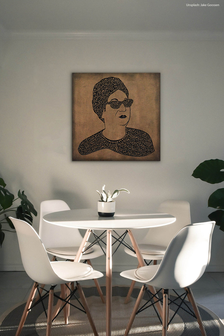 Carved wood portrait of Umm Kulthum with “Enta Omri” lyrics in living room.