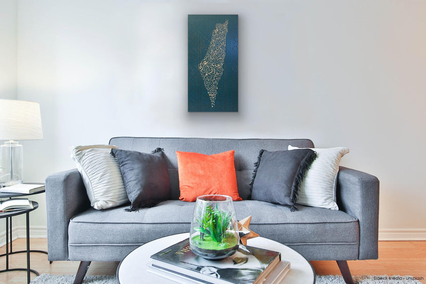 Palestine map in Diwani calligraphy using the names of its cities, with Palestinian tatreez–inspired embroidery in a living room.