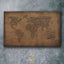 Carved wood artwork of the world map, carved in Diwani calligraphy featuring country names.