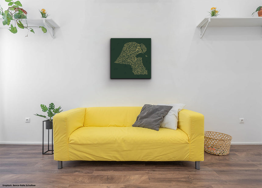 Carved wood artwork of the Kuwait map, drawn in Diwani calligraphy using the names of its cities in a living room setting.