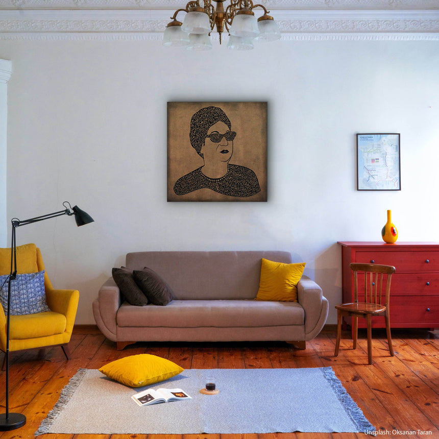 Carved wood portrait of Umm Kulthum with “Enta Omri” lyrics in living room.