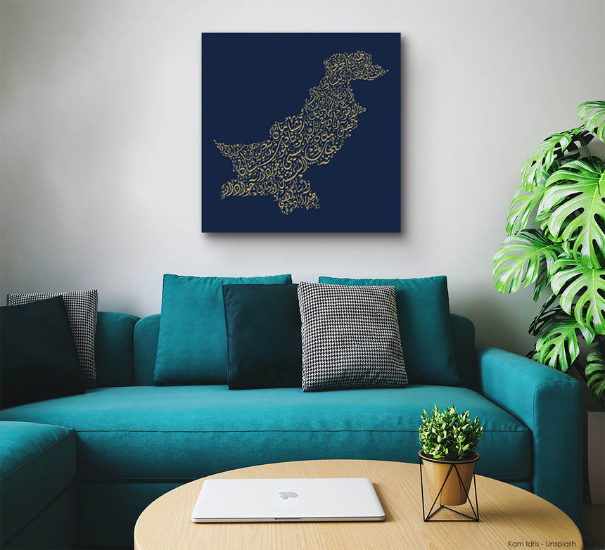 Carved wood artwork of the Pakistan map, featuring the names of its cities in a living room.