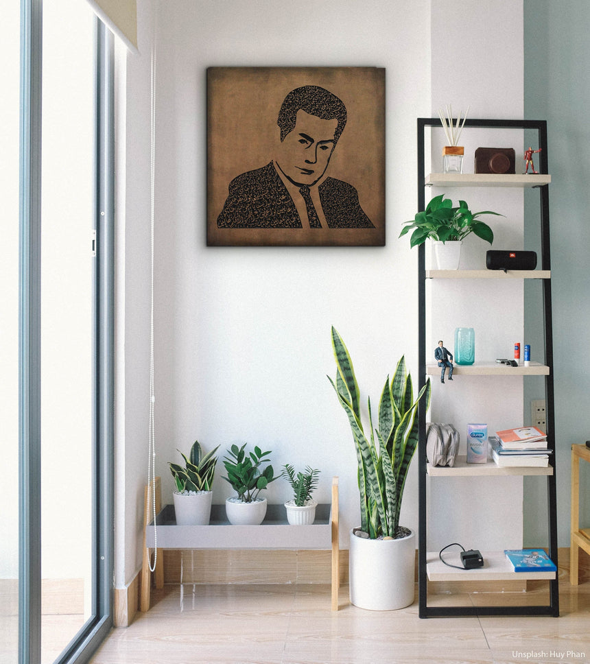 Carved wood portrait of Farid al-Atrash with “Ya Habaybi Ya Ghaybin” in a living room.