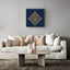 Carved wooden artwork of Surah Al-Falaq in a living room.