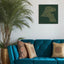 Carved wood artwork of the Kuwait map, drawn in Diwani calligraphy using the names of its cities in a living room setting.