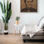 Carved wood portrait of Abdel Halim Hafez with “Ahwak” song in a living room.