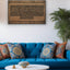 Wooden artwork of Ayat al-Kursi in Kufic calligraphy in a living room