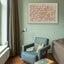 Carved wooden artwork featuring Quran 2:216 in the living room