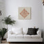 Carved wooden artwork of Surah An-Nas in a living room