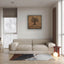 Wooden artwork of an olive tree with the quote “We will remain as long as thyme and olives remain.”  in a living room