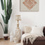 Carved wooden artwork of Surah Al-Falaq in a living room.