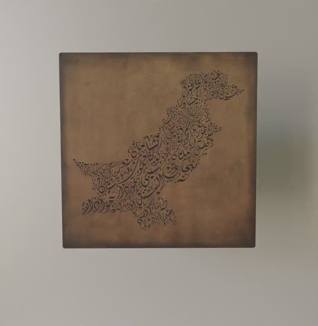 Carved wood artwork of the Pakistan map, featuring the names of its cities up close