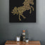 The horse and the night illustrated by Al-Mutanabbi poem : black background, gold carving